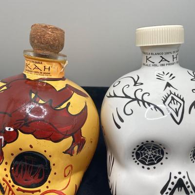 LOT 177: Pair of Kah Tequila Scull Bottles / Decanters, Set of Four Rocks Glasses and Glass Bottle with Wire Bail Swing Top Lid