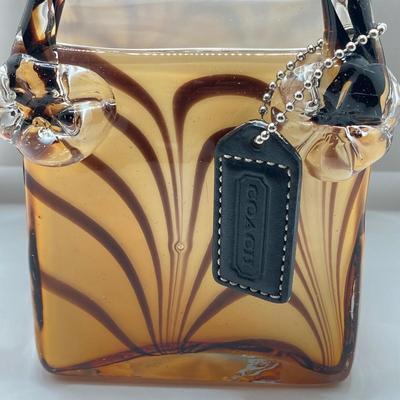 LOT 178: Lenox Kate Spade One In A Million Mug, Art Glass Animal Print Handbag Vase, Leather Coach Hang Tag and Krispy Kreme Mug