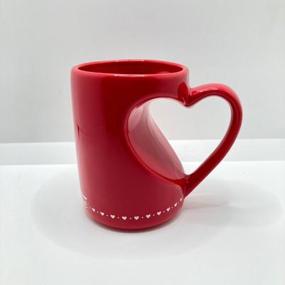LOT 178: Lenox Kate Spade One In A Million Mug, Art Glass Animal Print Handbag Vase, Leather Coach Hang Tag and Krispy Kreme Mug