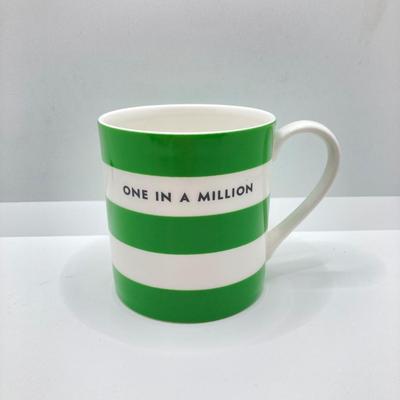 LOT 178: Lenox Kate Spade One In A Million Mug, Art Glass Animal Print Handbag Vase, Leather Coach Hang Tag and Krispy Kreme Mug