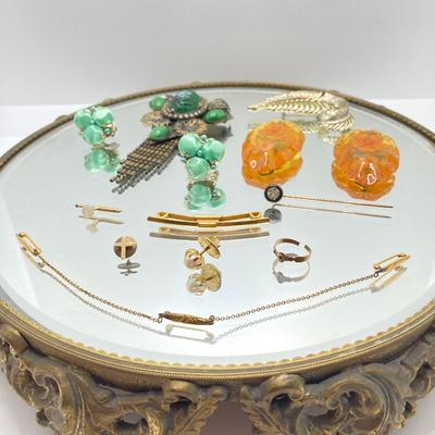 LOT 70: Vanity Mirror with Collection of Vintage Jewelry - Brooches / Pins, Shoe Clips, Clip-on Earrings, Adjustable Promise Ring and More