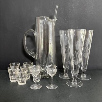 LOT 92: Sheffield Silve Plated Ice Bucket w/Lion Handles, Etched Pink Depressio Glasses (2), Etched Pilsner Glasses (3), MCM Gold Oak...