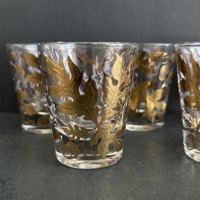 LOT 92: Sheffield Silve Plated Ice Bucket w/Lion Handles, Etched Pink Depressio Glasses (2), Etched Pilsner Glasses (3), MCM Gold Oak...