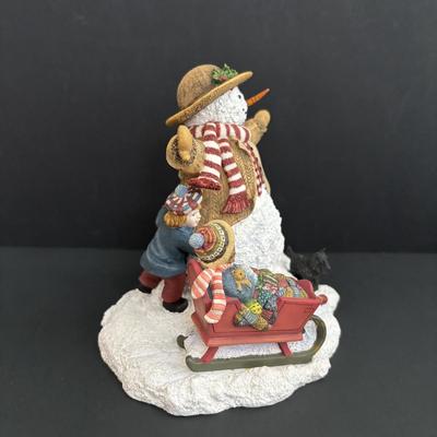 LOT 94: Sherri Buck Baldwin "Weekend Play" Figure, Thomas Kinkade Tele Flora Candle Holder & Holiday Caroling Figures