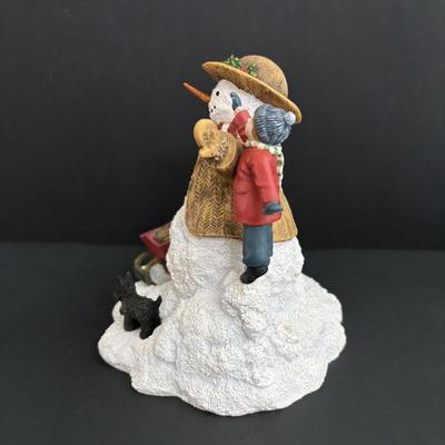 LOT 94: Sherri Buck Baldwin "Weekend Play" Figure, Thomas Kinkade Tele Flora Candle Holder & Holiday Caroling Figures