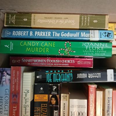 Large assortment of Paperback books - Elizabeth Peters - Jimmy Buffet - Stuart Woods and other Great Authors