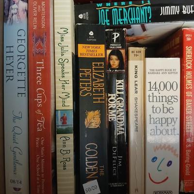 Large assortment of Paperback books - Elizabeth Peters - Jimmy Buffet - Stuart Woods and other Great Authors