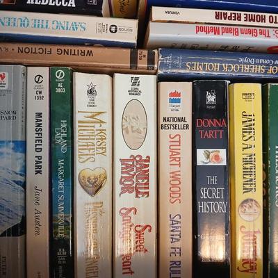 Large assortment of Paperback books - Elizabeth Peters - Jimmy Buffet - Stuart Woods and other Great Authors