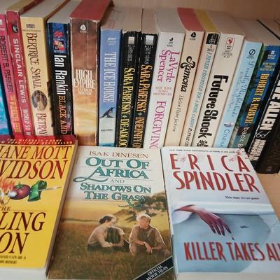 Two shelves of paperback books - Janet Evanovich - Eric Spindler - Ken Follett - and many other Authors - Great reads!