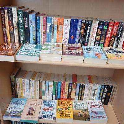Two shelves of paperback books - Janet Evanovich - Eric Spindler - Ken Follett - and many other Authors - Great reads!