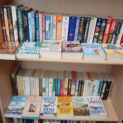 Two shelves of paperback books - Janet Evanovich - Eric Spindler - Ken Follett - and many other Authors - Great reads!