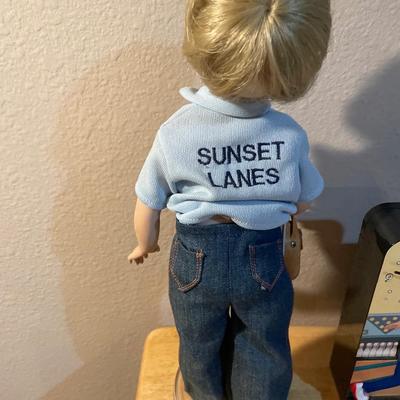 Bowling decor with doll, clock, phone and pin