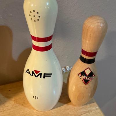 Bowling decor with doll, clock, phone and pin