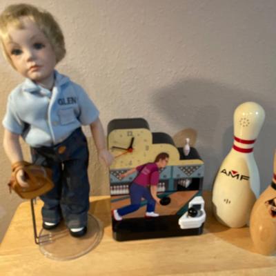 Bowling decor with doll, clock, phone and pin