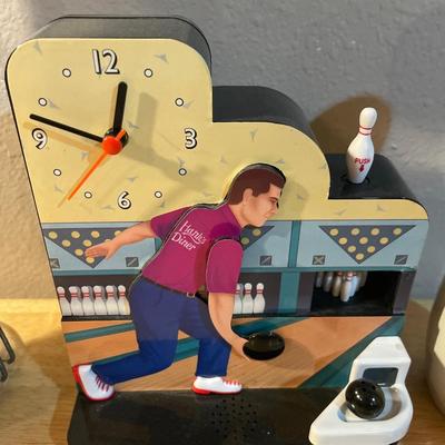 Bowling decor with doll, clock, phone and pin