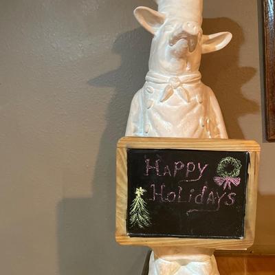 Pig with sign statue