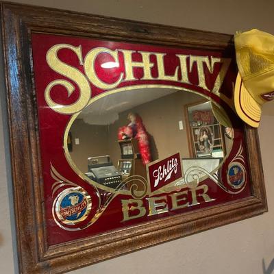 Schlitz mirror and hat