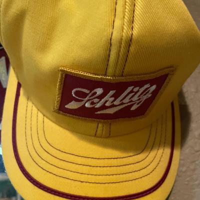Schlitz mirror and hat