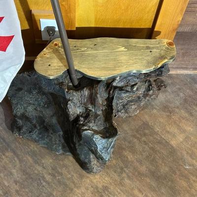 CHUNK OF WOOD WITH LIGHTED FLAG POLE AND FLAG