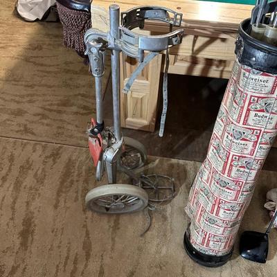 SET OF GOLF CLUBS, BUDWEISER BAG, GOLF BALLS AND DOLLY