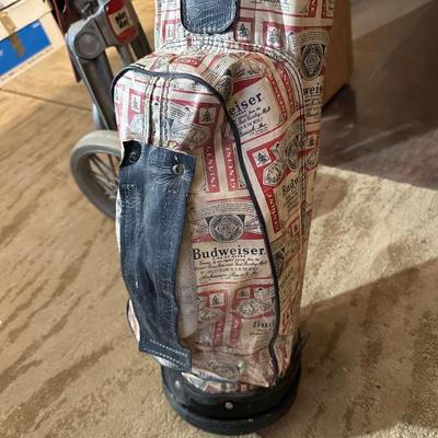 SET OF GOLF CLUBS, BUDWEISER BAG, GOLF BALLS AND DOLLY