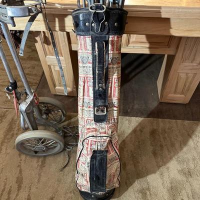 SET OF GOLF CLUBS, BUDWEISER BAG, GOLF BALLS AND DOLLY