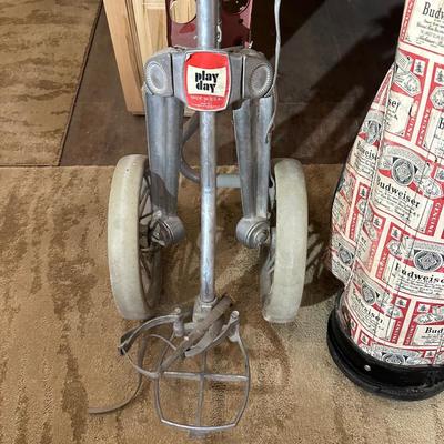 SET OF GOLF CLUBS, BUDWEISER BAG, GOLF BALLS AND DOLLY