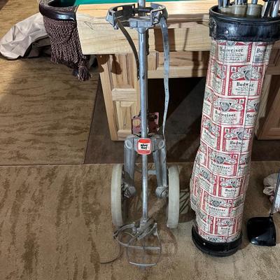 SET OF GOLF CLUBS, BUDWEISER BAG, GOLF BALLS AND DOLLY