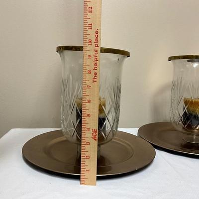Large crystal hurricane candle holders on a charger plate