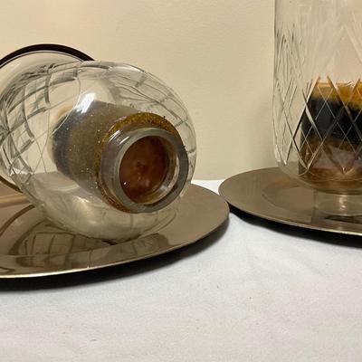 Large crystal hurricane candle holders on a charger plate