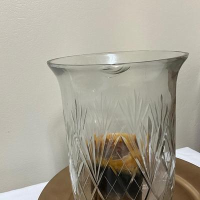 Large crystal hurricane candle holders on a charger plate