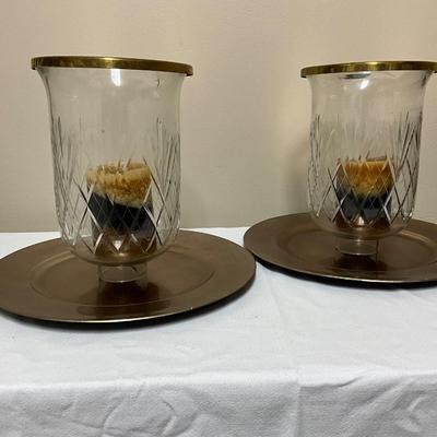 Large crystal hurricane candle holders on a charger plate