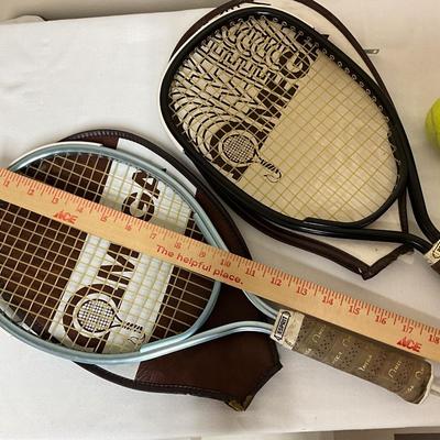 2 rackets with cases and 3 tennis balls