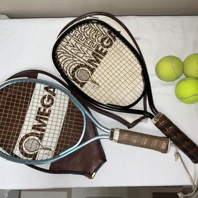 2 rackets with cases and 3 tennis balls