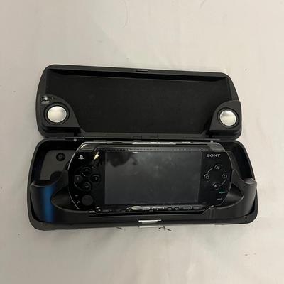 Sony PSP With Movies, NYKO Speaker Case & More (G-MG)