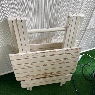 3 white patio tables