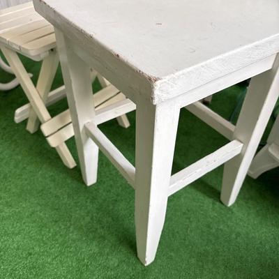 3 white patio tables