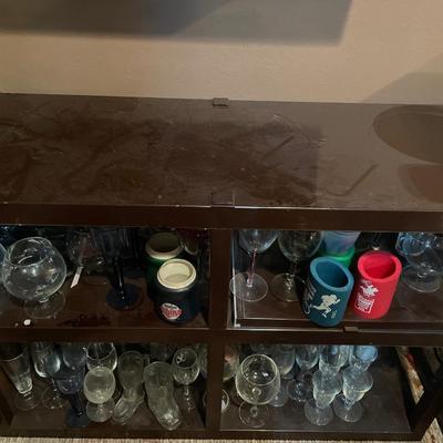 Plastic storage shelves full of clear wine glasses