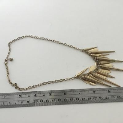 Unmarked gold tone spike necklace