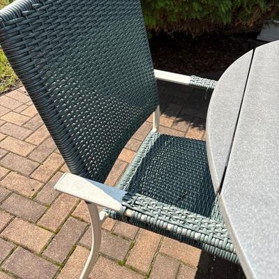 Composite patio table, umbrella with stand and three chairs