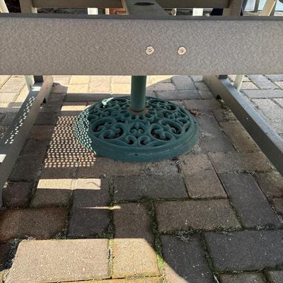 Composite patio table, umbrella with stand and three chairs