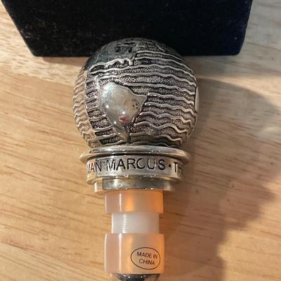 Colored glass in a vase with Neiman Marcus Cork