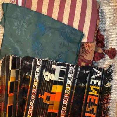 Embroidered pillowcases, table, runners, and holder