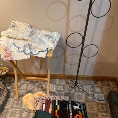 Embroidered pillowcases, table, runners, and holder