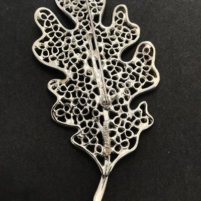 Sale Photo Thumbnail #171: Vintage, silver tone, maple leaf brooch by Sarah Coventry. Please see attached photos.
