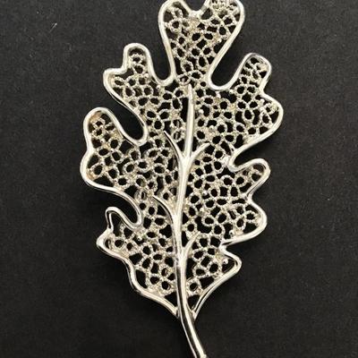 Sale Photo Thumbnail #169: Vintage, silver tone, maple leaf brooch by Sarah Coventry. Please see attached photos.