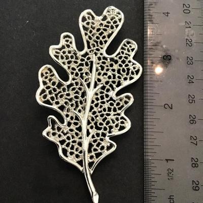 Sale Photo Thumbnail #170: Vintage, silver tone, maple leaf brooch by Sarah Coventry. Please see attached photos.