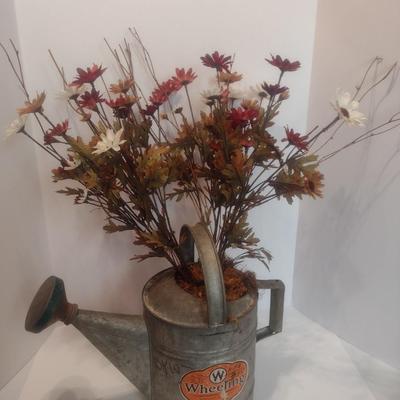 Vintage Galvanized Watering Can Being Used as a Planter