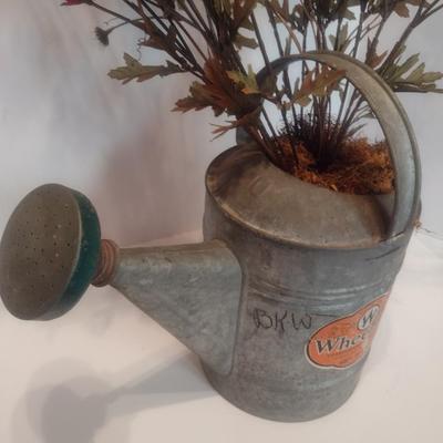 Vintage Galvanized Watering Can Being Used as a Planter