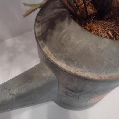 Vintage Galvanized Watering Can Being Used as a Planter